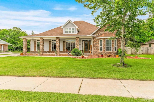 view of front of house featuring a front yard and fence