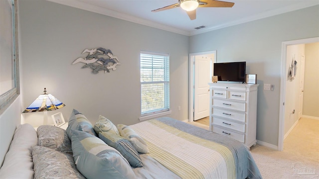 carpeted bedroom with crown molding and ceiling fan