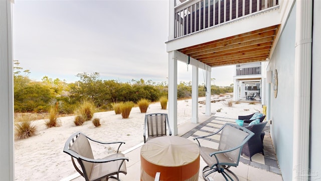 view of patio featuring a balcony