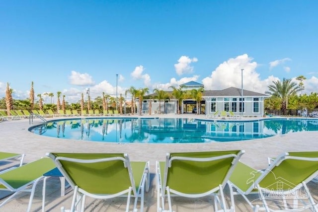 view of swimming pool featuring a patio area