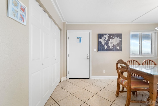 1111 Ft Pickens Rd Unit 111, Pensacola Beach, FL 32561 - dining area featuring ornamental molding and light tile patterned floors