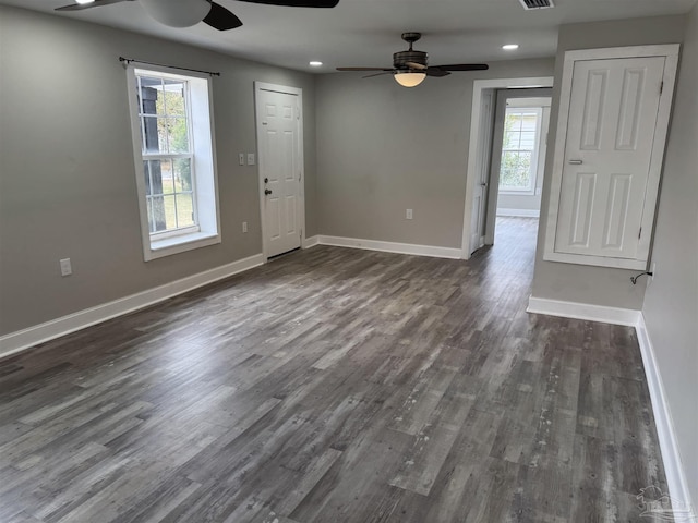 spare room featuring dark hardwood / wood-style flooring