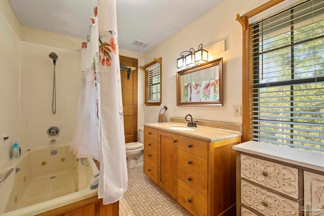 full bathroom with a textured ceiling, shower / bath combination with curtain, toilet, vanity, and tile patterned flooring