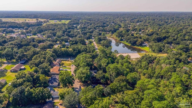 aerial view with a water view and a wooded view