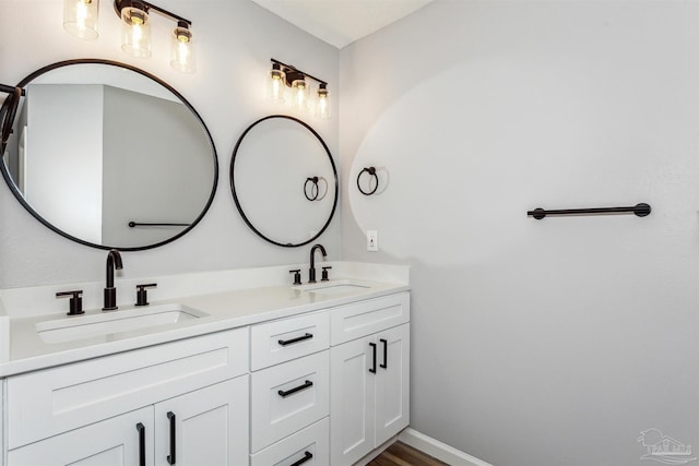 bathroom with wood-type flooring and vanity