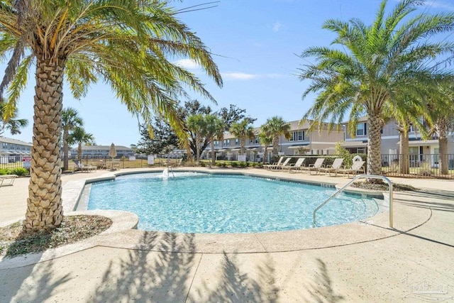 view of swimming pool featuring a patio area