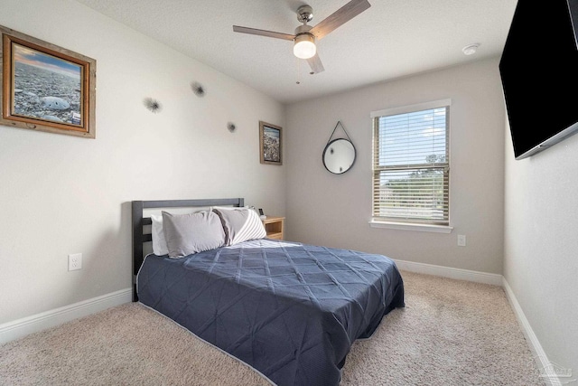 bedroom with ceiling fan and carpet floors