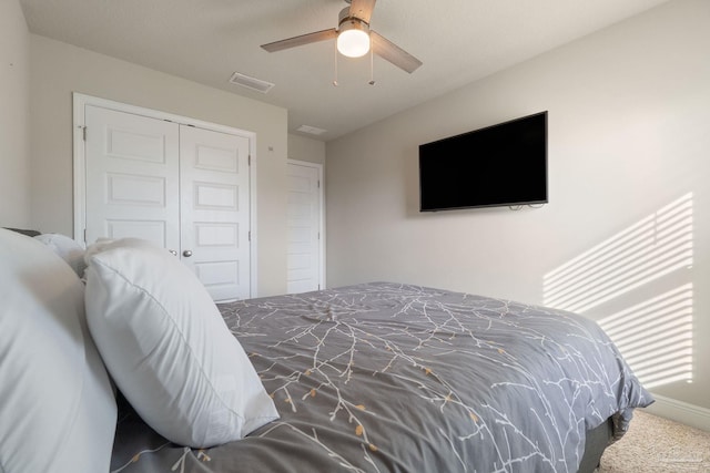 bedroom with carpet flooring, a closet, and ceiling fan