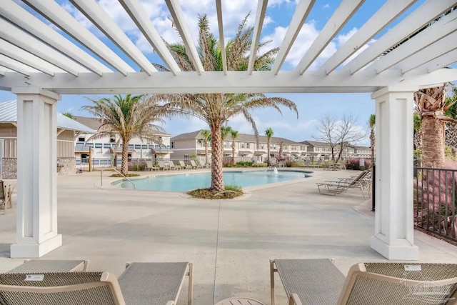 view of swimming pool with a pergola and a patio