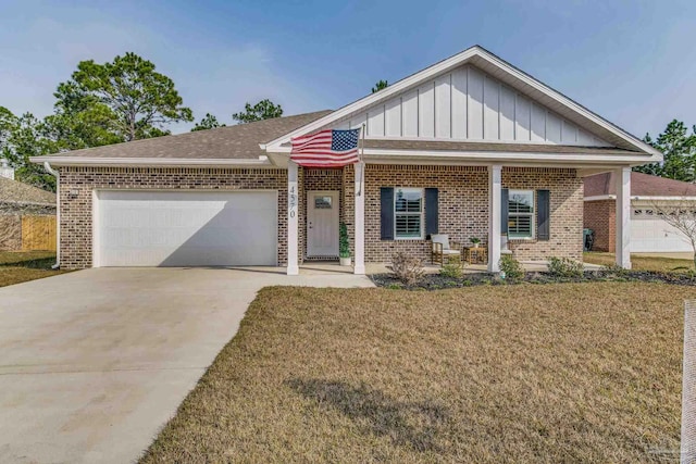 view of front facade featuring a garage and a front lawn