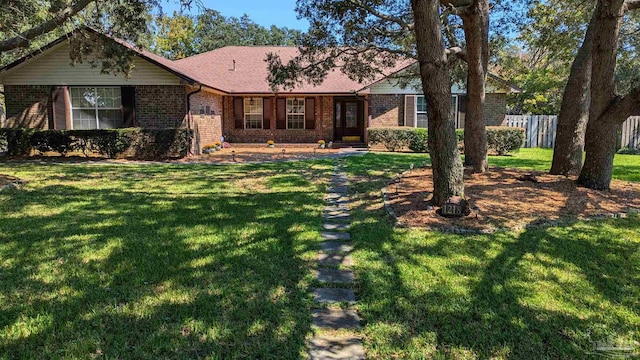 single story home featuring a front lawn