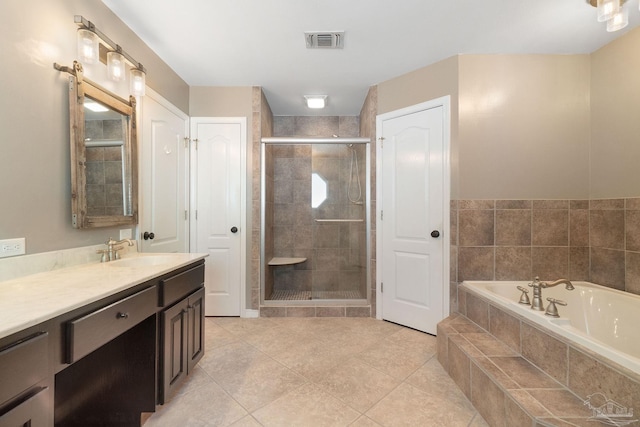 bathroom with vanity, shower with separate bathtub, and tile patterned flooring