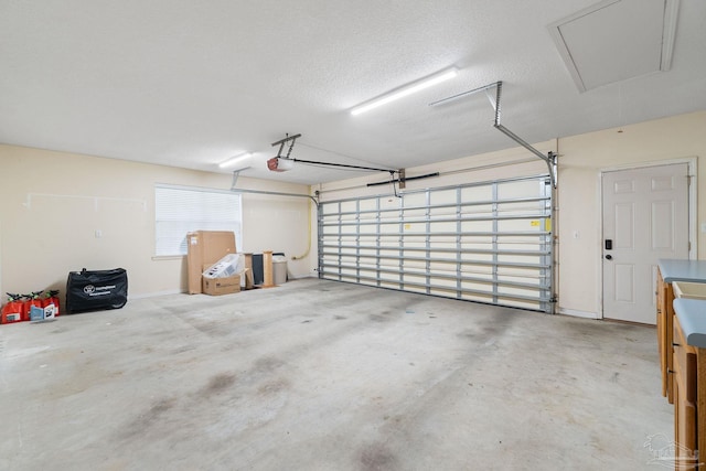 garage featuring a garage door opener