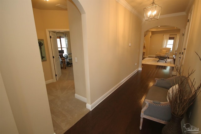 4135 Dundee Crossing Dr, Pace, FL 32571 - hallway with arched walkways, ornamental molding, baseboards, and wood finished floors