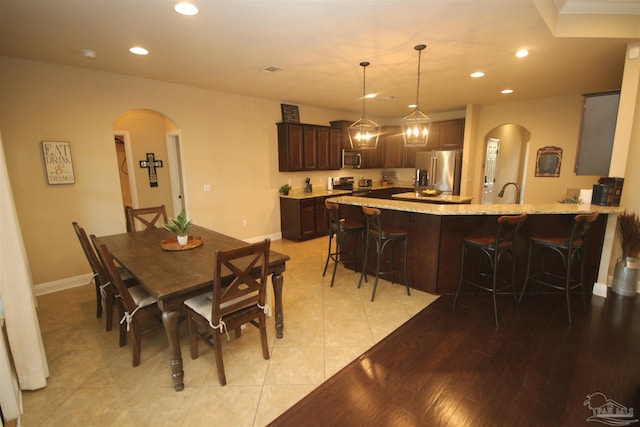 4135 Dundee Crossing Dr, Pace, FL 32571 - dining room with arched walkways, recessed lighting, and baseboards