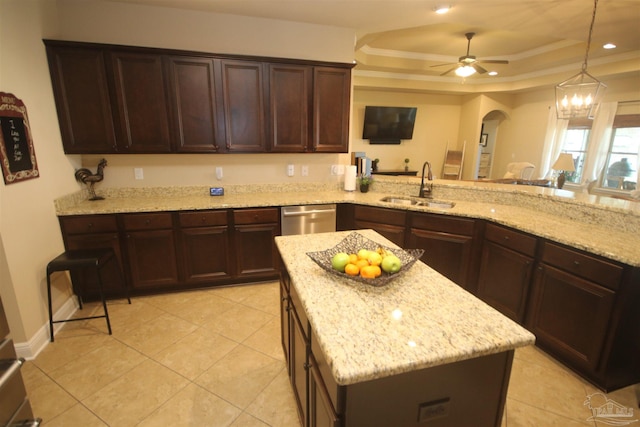 4135 Dundee Crossing Dr, Pace, FL 32571 - kitchen with a sink, dishwasher, a raised ceiling, arched walkways, and light stone countertops
