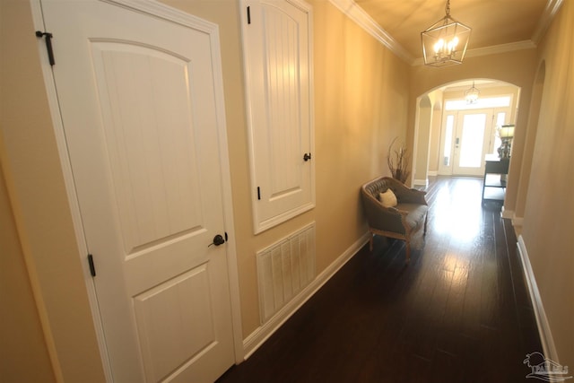 4135 Dundee Crossing Dr, Pace, FL 32571 - hallway featuring arched walkways, dark wood-style flooring, baseboards, crown molding, and a chandelier