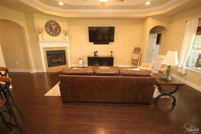 4135 Dundee Crossing Dr, Pace, FL 32571 - living area featuring arched walkways, a raised ceiling, ornamental molding, a fireplace, and recessed lighting