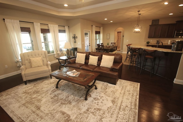 4135 Dundee Crossing Dr, Pace, FL 32571 - living area featuring arched walkways, ornamental molding, recessed lighting, dark wood-style flooring, and baseboards