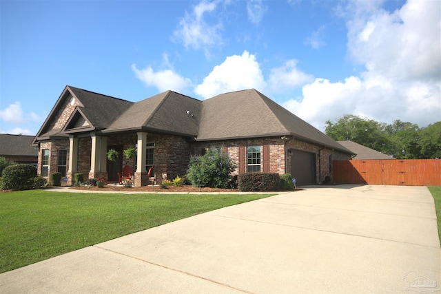 4135 Dundee Crossing Dr, Pace, FL 32571 - view of front facade featuring brick siding, driveway, an attached garage, a gate, and roof with shingles