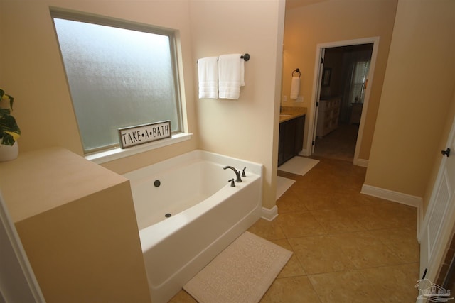 4135 Dundee Crossing Dr, Pace, FL 32571 - full bathroom with a garden tub, vanity, tile patterned floors, and baseboards