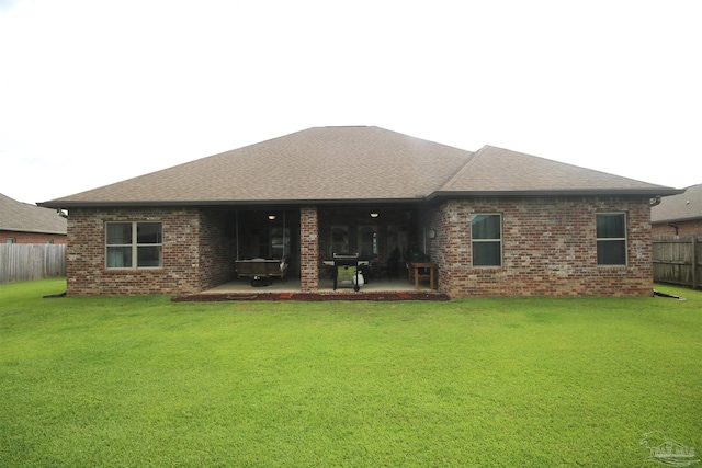 4135 Dundee Crossing Dr, Pace, FL 32571 - back of property with brick siding, a patio area, and a shingled roof