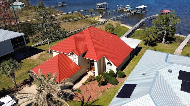 birds eye view of property with a water view