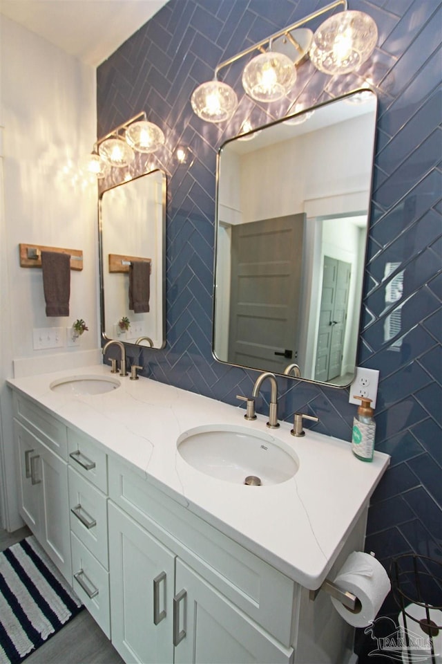 bathroom featuring vanity, tasteful backsplash, and tile walls