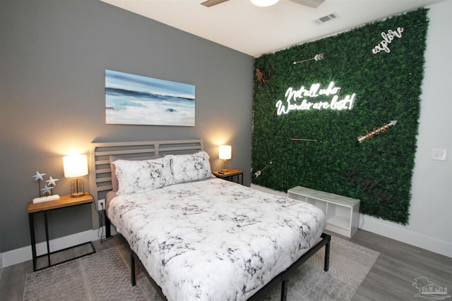 bedroom featuring ceiling fan and wood-type flooring