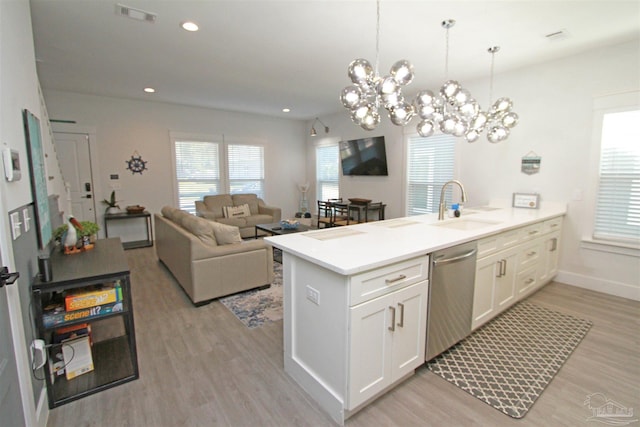 kitchen with dishwasher, light hardwood / wood-style flooring, white cabinetry, and sink