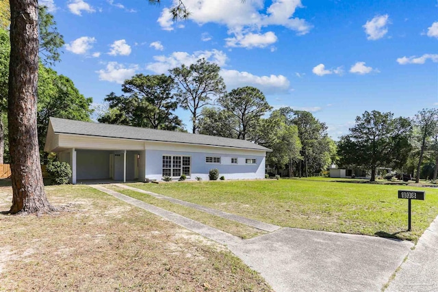808 Woodland Dr, Pensacola, FL 32503 - view of front of house with a front lawn, driveway, and an attached carport