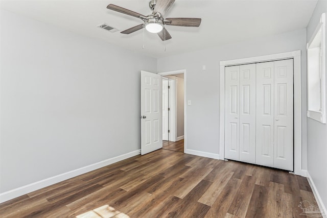 808 Woodland Dr, Pensacola, FL 32503 - unfurnished bedroom with wood finished floors, visible vents, a closet, baseboards, and ceiling fan