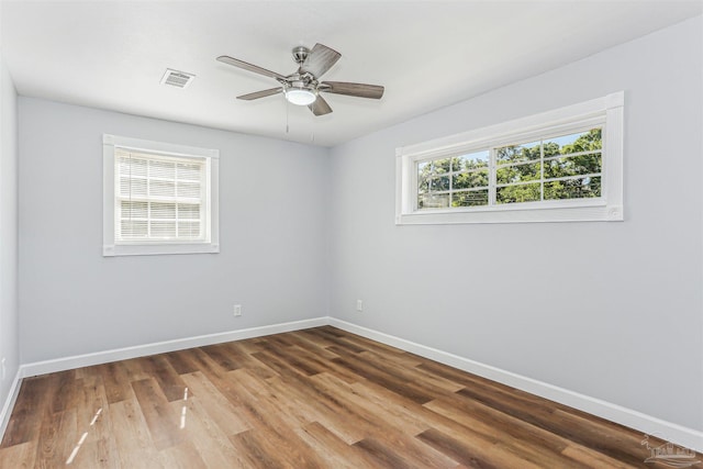 808 Woodland Dr, Pensacola, FL 32503 - unfurnished room featuring baseboards, wood finished floors, visible vents, and ceiling fan