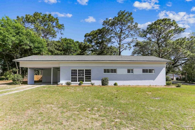 808 Woodland Dr, Pensacola, FL 32503 - single story home with concrete block siding, driveway, a front lawn, and a carport