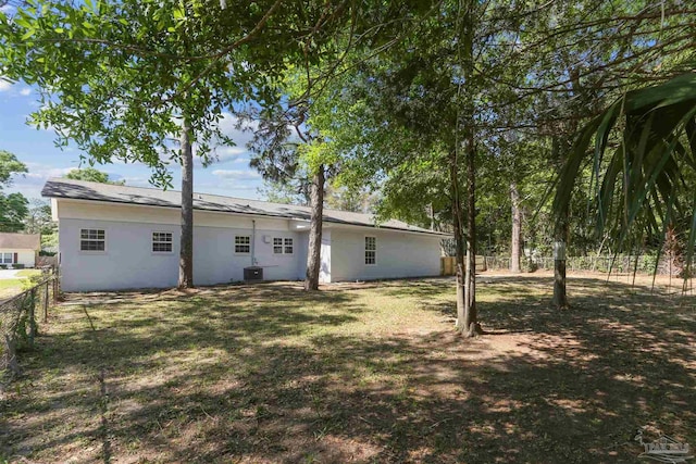808 Woodland Dr, Pensacola, FL 32503 - back of property featuring a yard, central air condition unit, and fence