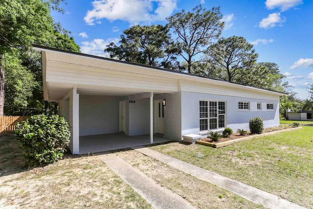 808 Woodland Dr, Pensacola, FL 32503 - view of front of property featuring driveway, a front yard, a carport, and fence