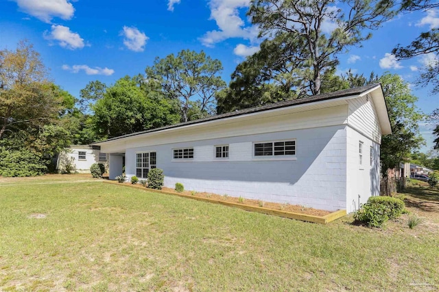 808 Woodland Dr, Pensacola, FL 32503 - rear view of property with a yard and concrete block siding