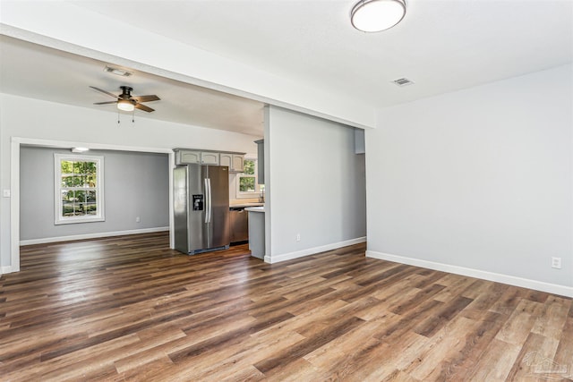808 Woodland Dr, Pensacola, FL 32503 - unfurnished living room featuring baseboards, a ceiling fan, visible vents, and dark wood-style flooring