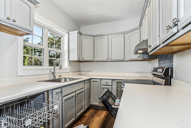 808 Woodland Dr, Pensacola, FL 32503 - kitchen with a sink, stainless steel range with electric cooktop, light countertops, under cabinet range hood, and gray cabinetry