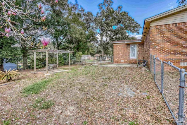 view of yard with a patio area, fence, and a pergola