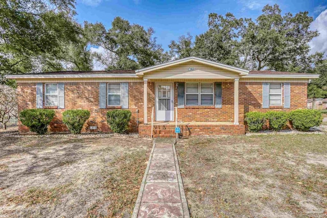 single story home featuring brick siding and crawl space