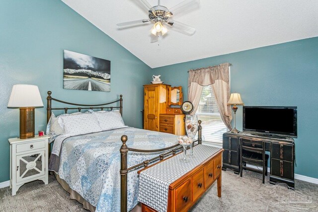 carpeted bedroom featuring lofted ceiling, baseboards, and a ceiling fan