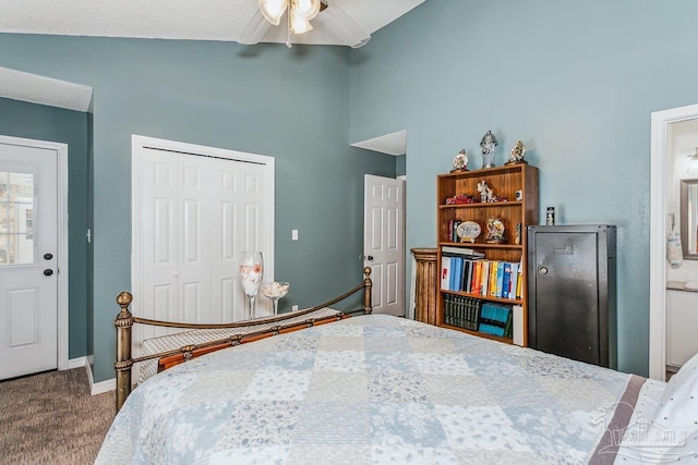 bedroom featuring a closet, carpet flooring, baseboards, a ceiling fan, and ensuite bath