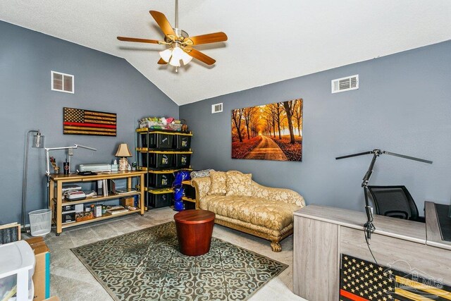 sitting room featuring ceiling fan, lofted ceiling, and carpet