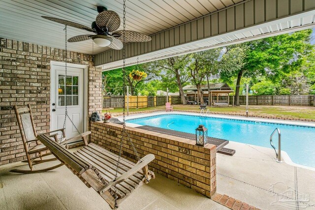 view of swimming pool featuring a ceiling fan, a gazebo, a fenced backyard, and a patio