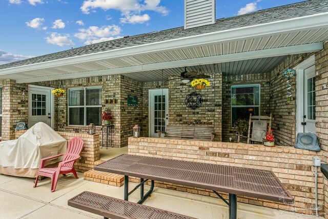 view of patio with covered porch and a grill