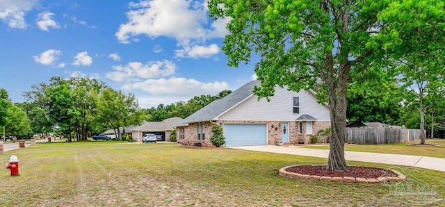 traditional-style home featuring an attached garage, driveway, and brick siding