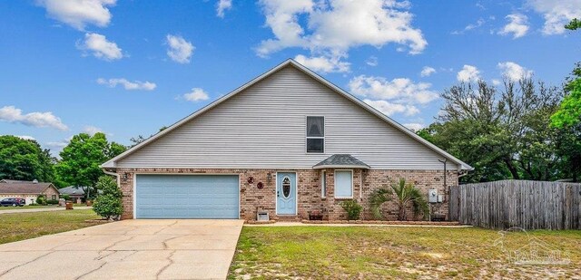 view of front of home with concrete driveway and brick siding