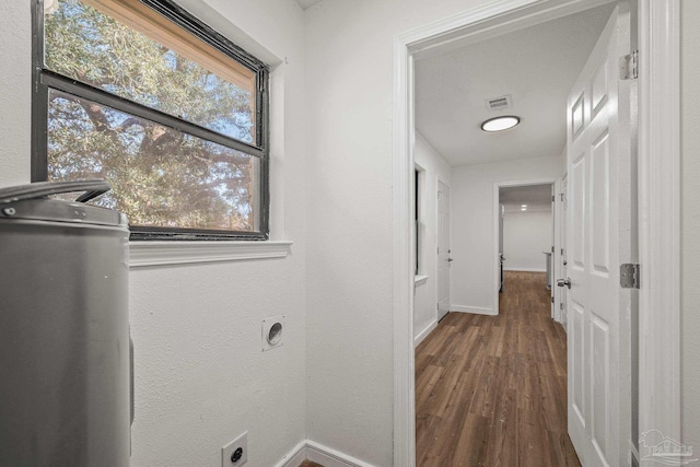 clothes washing area with laundry area, wood finished floors, visible vents, baseboards, and electric dryer hookup