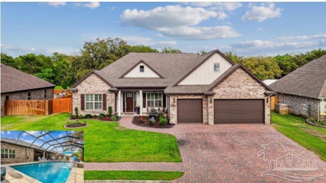 view of front facade with an attached garage, stone siding, fence, a front lawn, and driveway